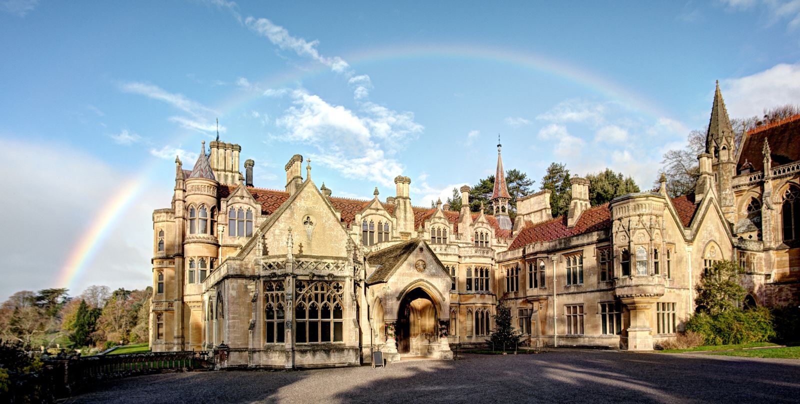 A rainbow over a stately home